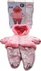 A pink winter snowsuit for a doll, with a box in the background. Produktbild-Vorschau