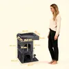 A woman stands next to a cat tree with dimensions labeled. Produktbild-Vorschau