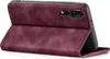 A burgundy flip case for a smartphone is shown in an open position, revealing the phone's camera module. Produktbild-Vorschau