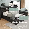 A bedroom scene featuring a black upholstered bed with storage, showcasing its features. Náhľad obrázku produktu