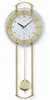 A wall clock with a pendulum. Anteprima dell’immagine prodotto