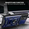 A blue and black rugged phone case with a ring stand is displayed on a textured surface, with a laptop and headphones in the background. Produktbild-Vorschau