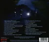 Four people on bicycles at night, with one person's headlight illuminating the scene. Anteprima dell’immagine prodotto