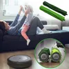 A mother and child playing on a couch, with a robot vacuum and replacement brush rolls shown in the foreground and upper right corner. Produktbild-Vorschau