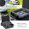A person holding a drone near an open protective case with foam inserts. Produktbild-Vorschau