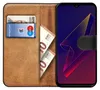 A book-style phone case open to reveal a card slot with a bank card and euro banknotes, and a smartphone with a colorful abstract wallpaper. Produktbild-Vorschau