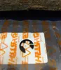 A black E-clip is placed on a white sheet with orange Stihl branding. Produktbild-Vorschau