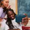 A man and a woman are taking a selfie with a Canon Zoemini S2 camera. Anteprima dell’immagine prodotto