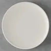 A top-down view of a white plate on a gray surface. Náhľad obrázku produktu