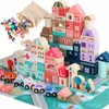 A collection of wooden building blocks forming a town scene, including buildings, vehicles, and a play mat. Náhled obrázku produktu