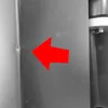 A close-up view of a metallic surface with a red arrow pointing to a small dent or imperfection. Produktbild-Vorschau