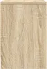 A close-up view of a wooden surface with a distinct grain pattern, likely a piece of furniture. Náhľad obrázku produktu