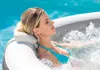 A woman relaxing in a hot tub. Voir les images du produit