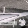 A close-up view of a gray fabric pillowcase with white stripes, showing a zipper closure. Produktbild-Vorschau
