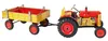 A toy tractor with a trailer, shown from a side-diagonal view against a white background. Produktbild-Vorschau