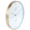 A close-up, angled view of a wall clock with a white face, gold frame, and integrated thermometer and hygrometer. Produktbild-Vorschau