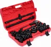 A red toolbox containing a set of black socket wrenches and accessories. Produktbild-Vorschau