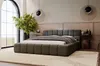 A modern bedroom with a large bed, plants, and decorative lighting. Produktbild-Vorschau