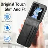 A hand holding a black flip case for a smartphone, with the phone screen visible through a window in the case. The case has card slots on the front. Náhľad obrázku produktu