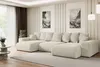 A large, sectional sofa in a modern living room. Produktbild-Vorschau