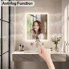 A bathroom vanity with a lit mirror, showcasing its anti-fog function. Anteprima dell’immagine prodotto