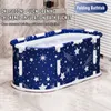 A blue and white star-patterned folding bathtub filled with water, placed on a tiled floor. Produktbild-Vorschau