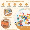 A collage of images showcasing the storage features of a children's activity table, including bookshelves and storage boxes, along with scattered building blocks and toys. Produktbild-Vorschau