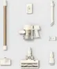 A collection of vacuum cleaner parts and accessories arranged on a light gray background. Podgląd zdjęcia produktu