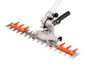 A close-up view of a hedge trimmer attachment with orange guards. Produktbild-Vorschau
