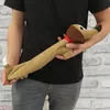 A person is holding a dachshund-shaped plush toy filled with grains and lavender. Produktbild-Vorschau