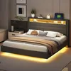 A modern bedroom with a bed featuring LED lighting and a headboard with storage. Produktbild-Vorschau