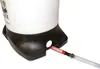 Close-up of the bottom of a white and black pressure vessel with a red filter attached to a clear tube extending from the vessel. Náhľad obrázku produktu