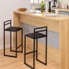 Two black bar stools are placed in front of a wooden kitchen counter. Anteprima dell’immagine prodotto