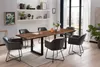 A dining room with a wooden table and chairs. Produktbild-Vorschau