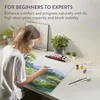 A person painting a landscape on a large canvas. Podgląd zdjęcia produktu