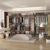 A well-lit, spacious walk-in closet with an open wardrobe system. Produktbild-Vorschau