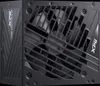 A close-up of a black computer power supply unit. Produktbild-Vorschau