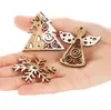 A hand holding several wooden Christmas ornaments. Produktbild-Vorschau