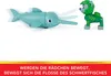 A toy dolphin and a toy dog figure are shown. The dolphin has motion lines indicating movement, and the dog is facing it. Anteprima dell’immagine prodotto
