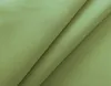 A close-up, angled view of a folded piece of green fabric. Produktbild-Vorschau