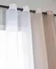Close-up view of curtains hanging on a rod. Produktbild-Vorschau