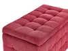 A close-up view of a red tufted ottoman or bench. Náhled obrázku produktu