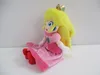 A plush toy of Princess Peach sitting down against a white background. Náhľad obrázku produktu