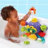 A young child playing with a bath toy in a bathtub. Podgląd zdjęcia produktu