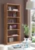 A wooden bookshelf filled with decorative items in a living room setting. Produktbild-Vorschau