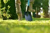 A person is digging in a garden with a shovel. Náhľad obrázku produktu
