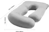 A grey U-shaped pillow with dimensions indicated by measurement lines and text. Voir les images du produit