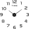 A black and white wall clock with large numbers and clock hands on a white background. Náhled obrázku produktu