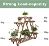 A wooden plant stand with plants on it, with text indicating load capacity. Produktbild-Vorschau