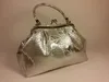 A silver handbag with a floral pattern is displayed against a light gray background. Podgląd zdjęcia produktu